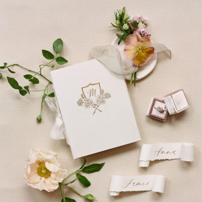 White linen crest fine art vow book Wedding Story Writer