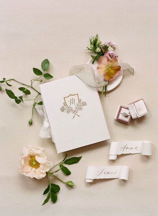 White linen crest fine art vow book Wedding Story Writer