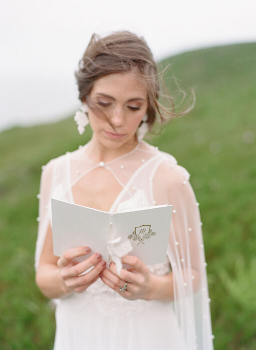 Textured-white-floral-crest-vow-book