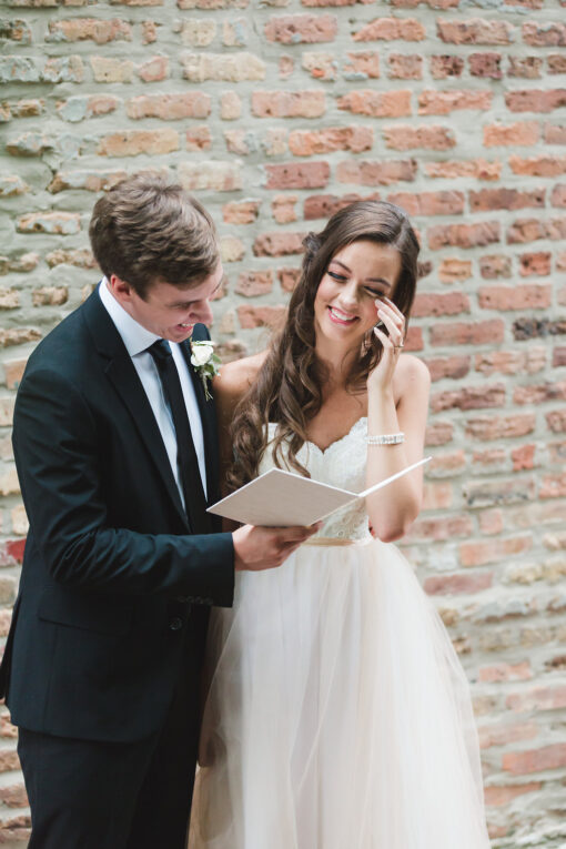 Bride-groom-reading-wedding-vows-vow-book